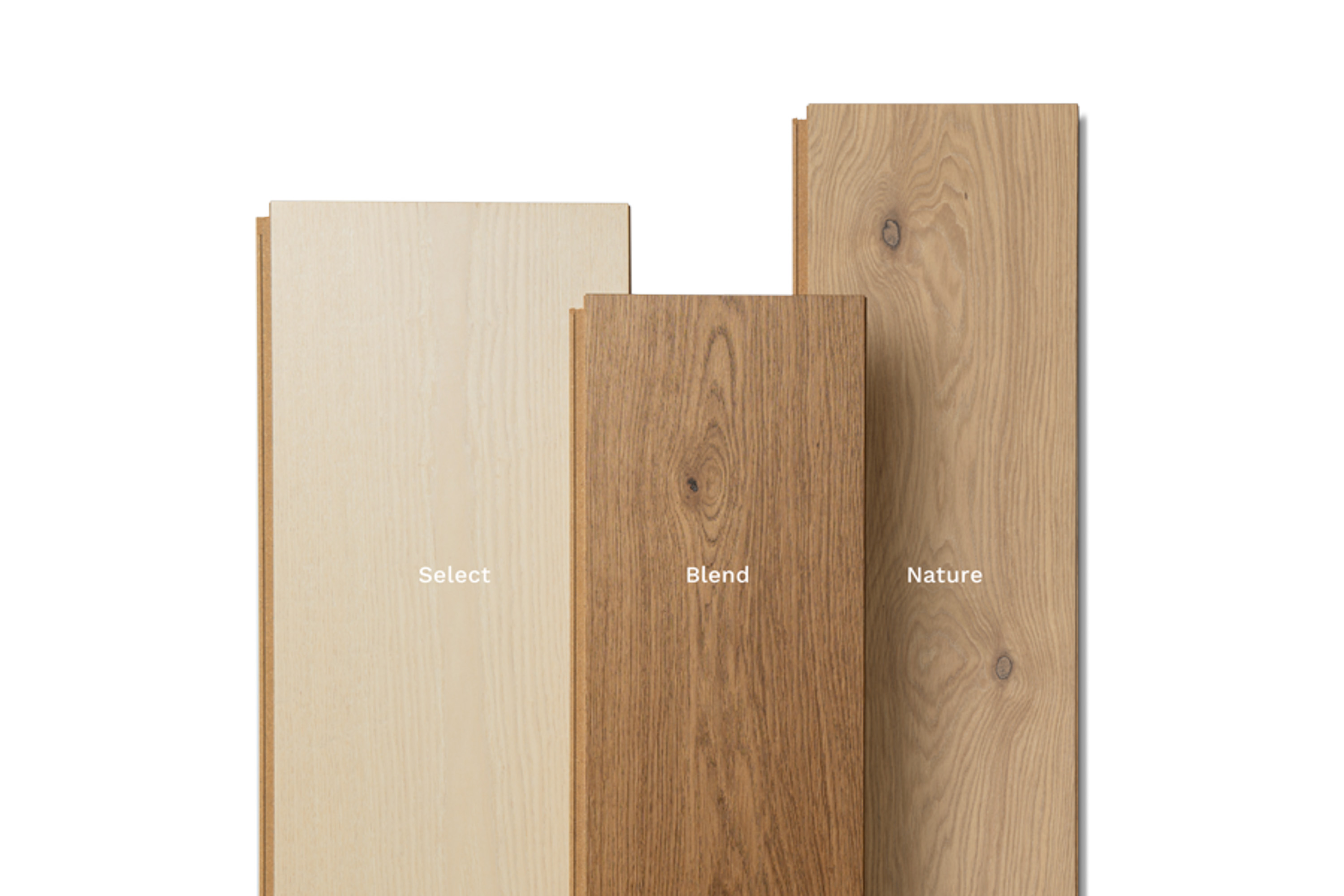 tre ulike gulvbord med lite, mer eller enda litt mer kvist og synlige årringer. 