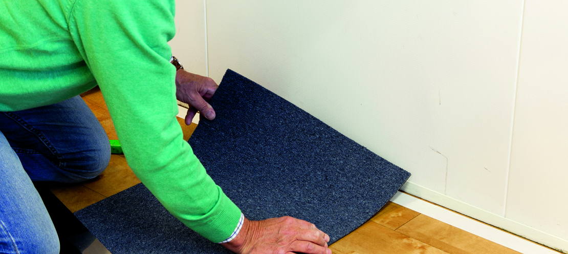 Legging av teppefliser